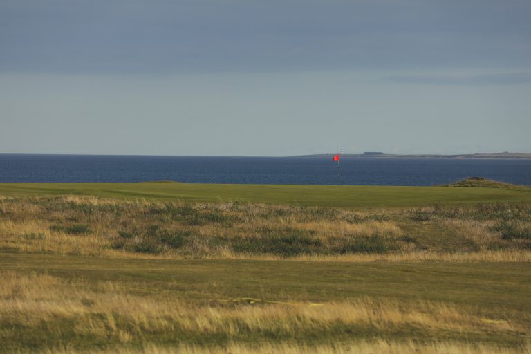 Royal Dornoch Golf Course in the Highlands with the 16th Hole overlooking the Moray Firth by AKH Golf Photography