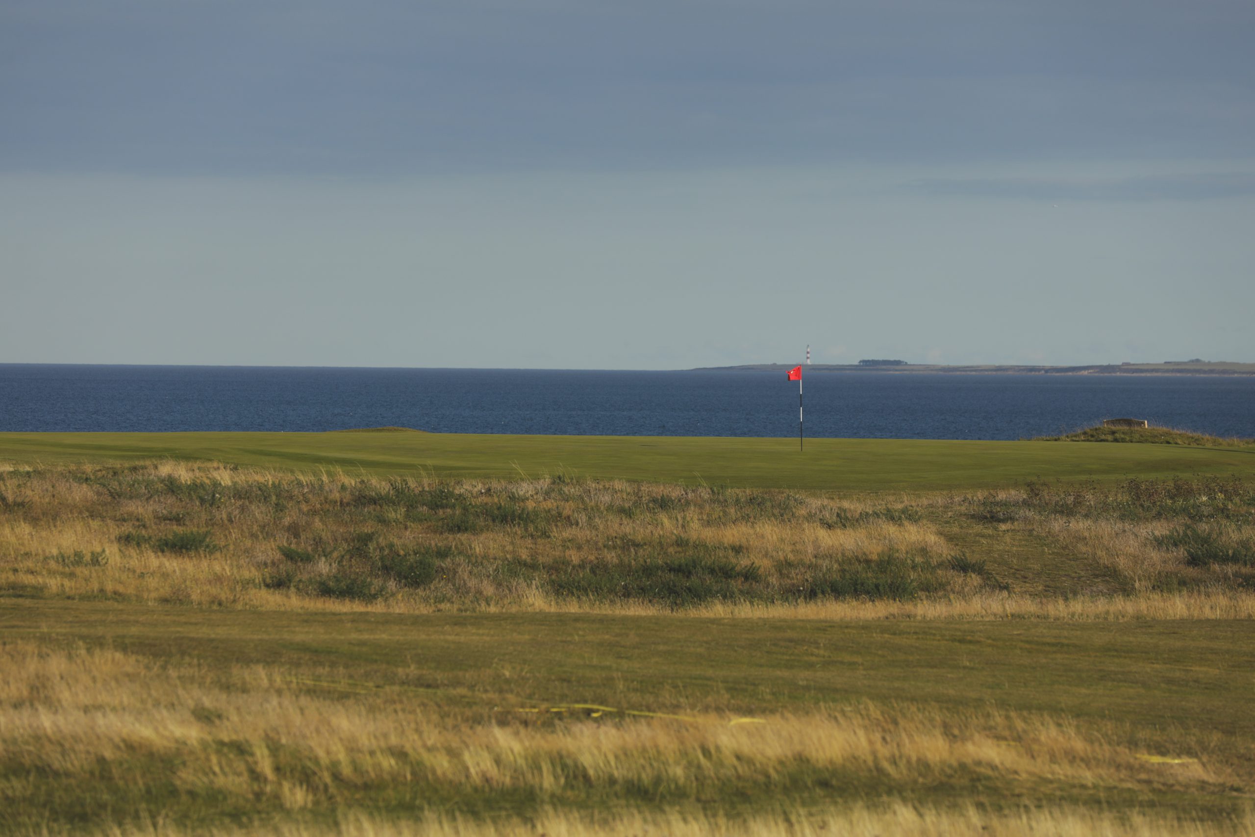 Royal Dornoch Golf Course in the Highlands with the 16th Hole overlooking the Moray Firth by AKH Golf Photography