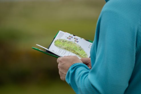 Close-up detail of a Royal Dornoch golf course yardage book