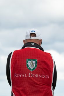 Close-up of the Royal Dornoch caddie bib worn during the round